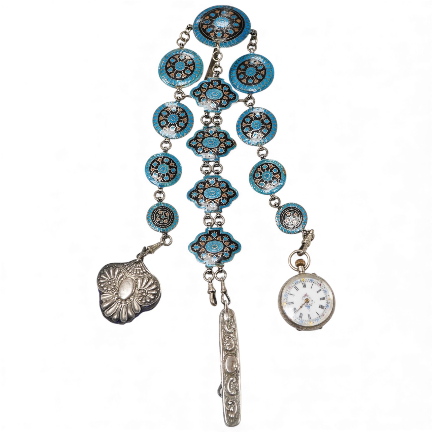 An enamel chatelaine, late 19th/early 20th century, composed of metal plaques applied with foliate patterns in blue, black and red enamel, indistinctly stamped maker's marks, suspending a silver pin cushion and a silver